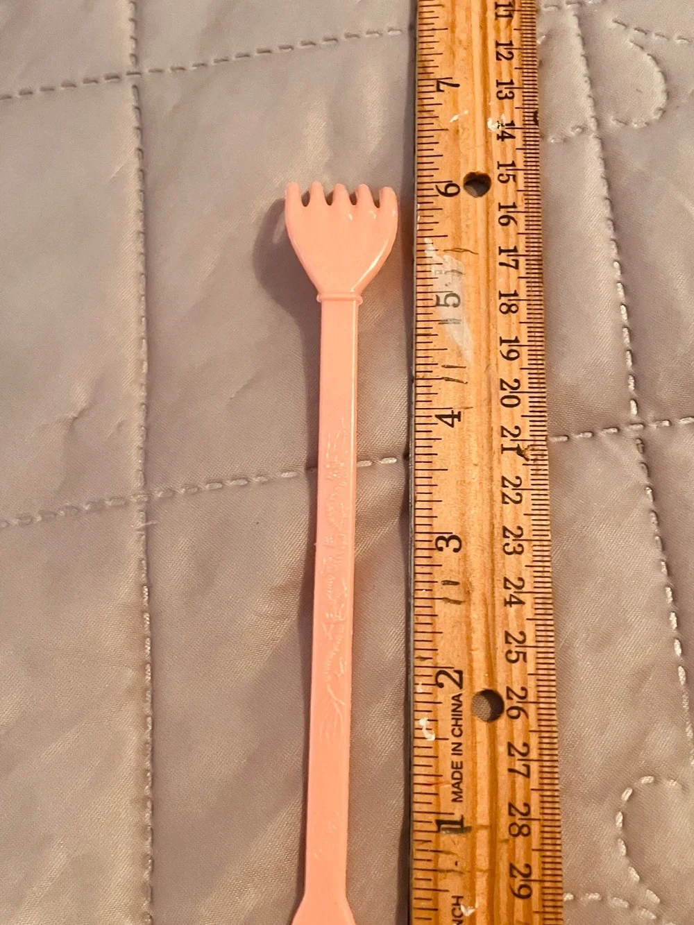 Long Peach Plastic Fork Spoon Utensil. Head Scratcher.